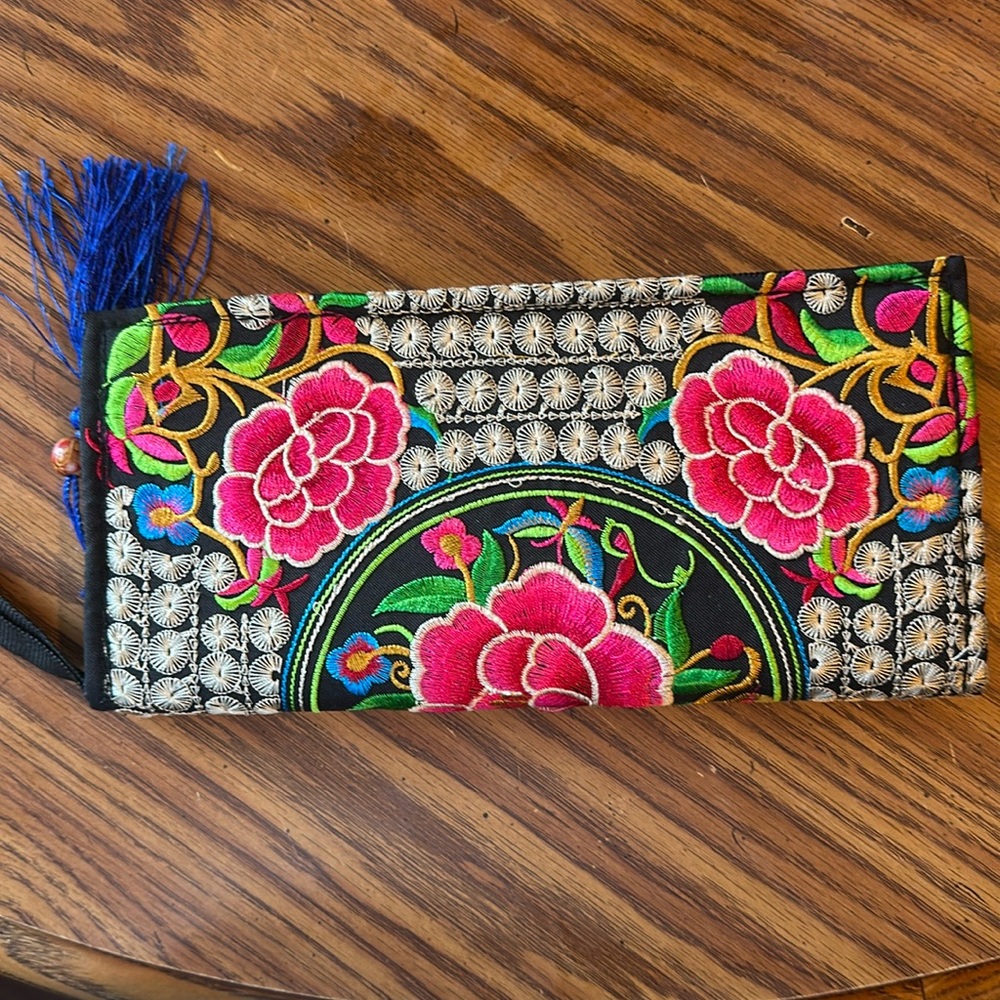 Embroidered Clutch.  Vibrant Colors. Excellent Used Condition. Zip closure.